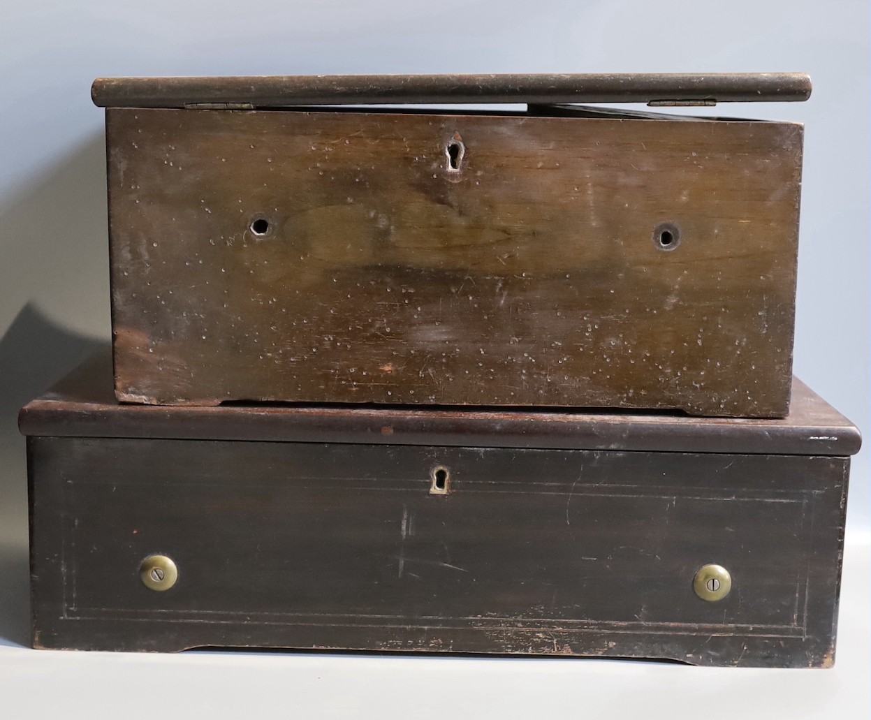 A 19th century and later Swiss music box, with 27cm cylinder, together with a music box case containing a quantity of music and clock parts